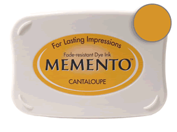 Buy a Memento Cantaloupe Stamp Pad! This is fast drying on most papers including glossy finishes.