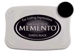 Buy a Memento Tuxedo Black Stamp Pad! This is fast drying on most papers including glossy finishes.